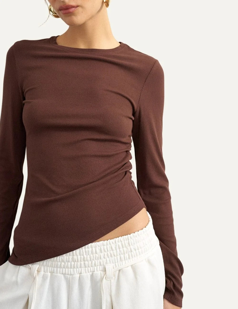 Topshop women's brown ribbed long-sleeve top with crew neck, side ruching and asymmetric hem.