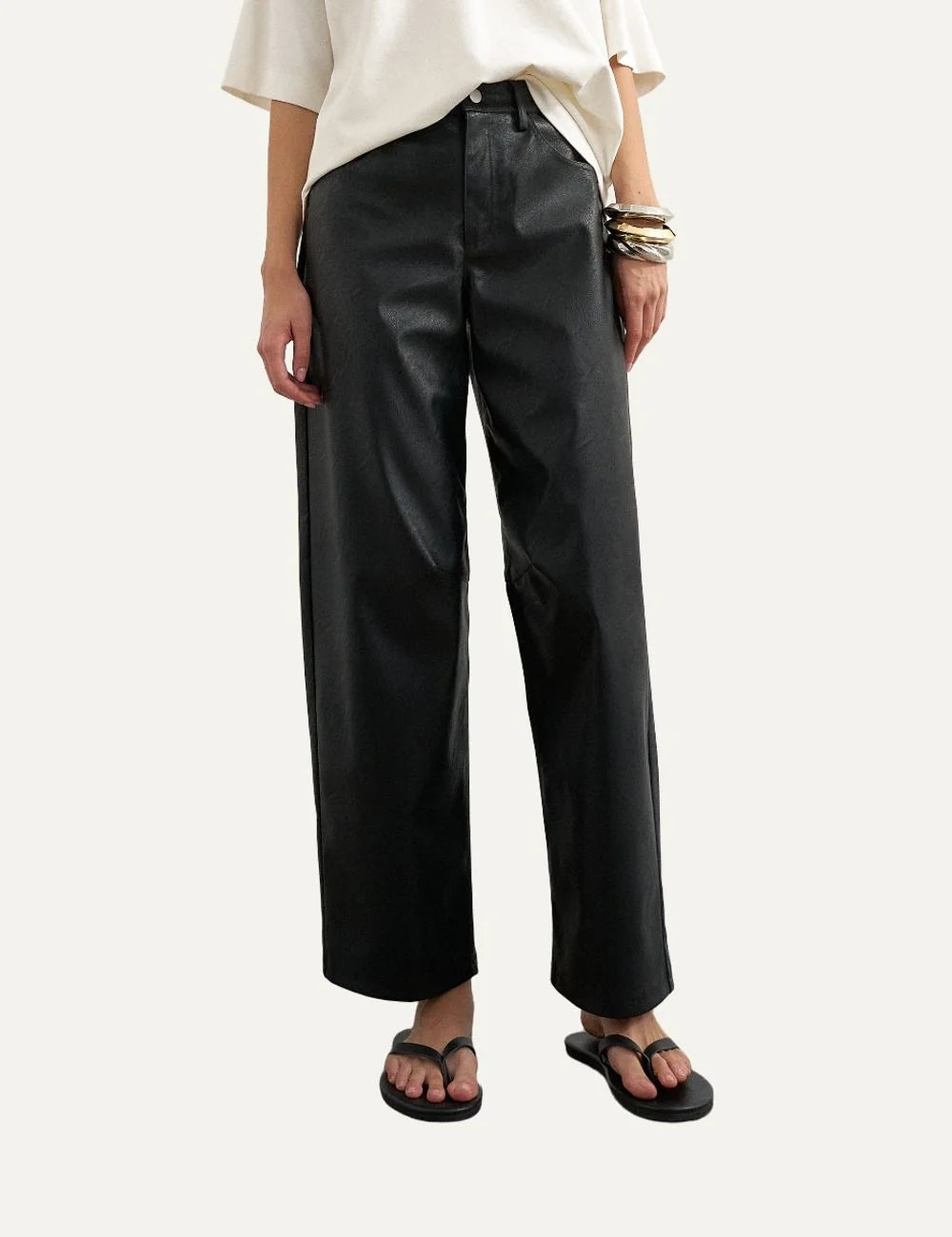 Topshop women's black faux leather barrel trousers with high waist, curved legs and front pockets.