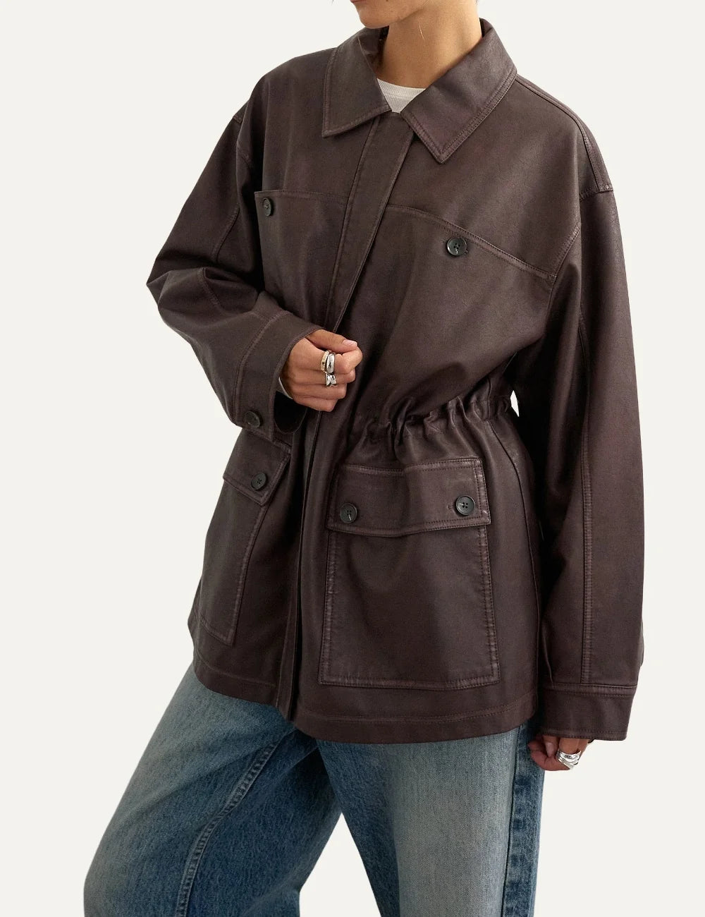 Topshop women's dark brown faux leather jacket with pointed collar, cinched waist and front flap pockets.