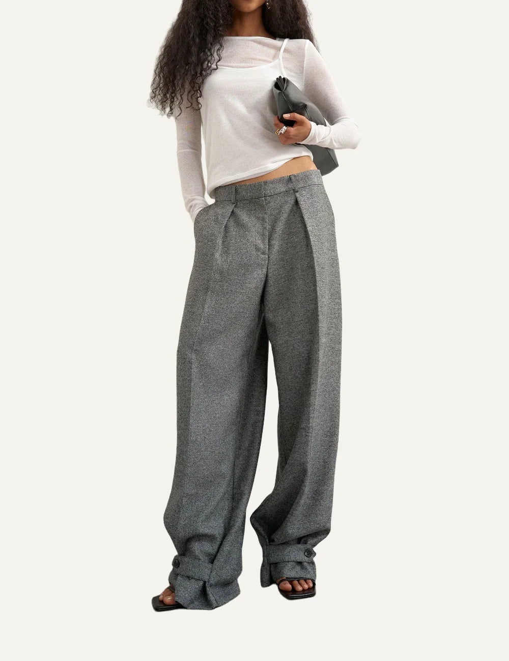 Topshop women's grey wide-leg tailored trousers with front pleats and buttoned hems.