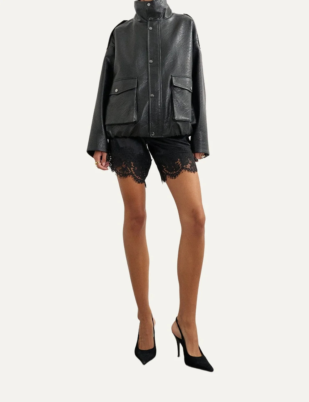 Topshop women's black faux leather bomber jacket with high stand collar, snap buttons and oversized flap pockets full body