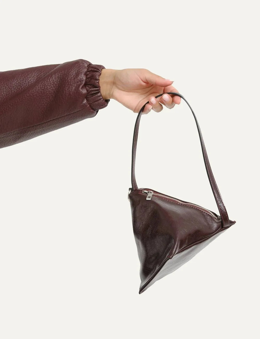 Topshop women's burgundy glossy crinkled triangular handbag with long strap and silver-tone side zipper model