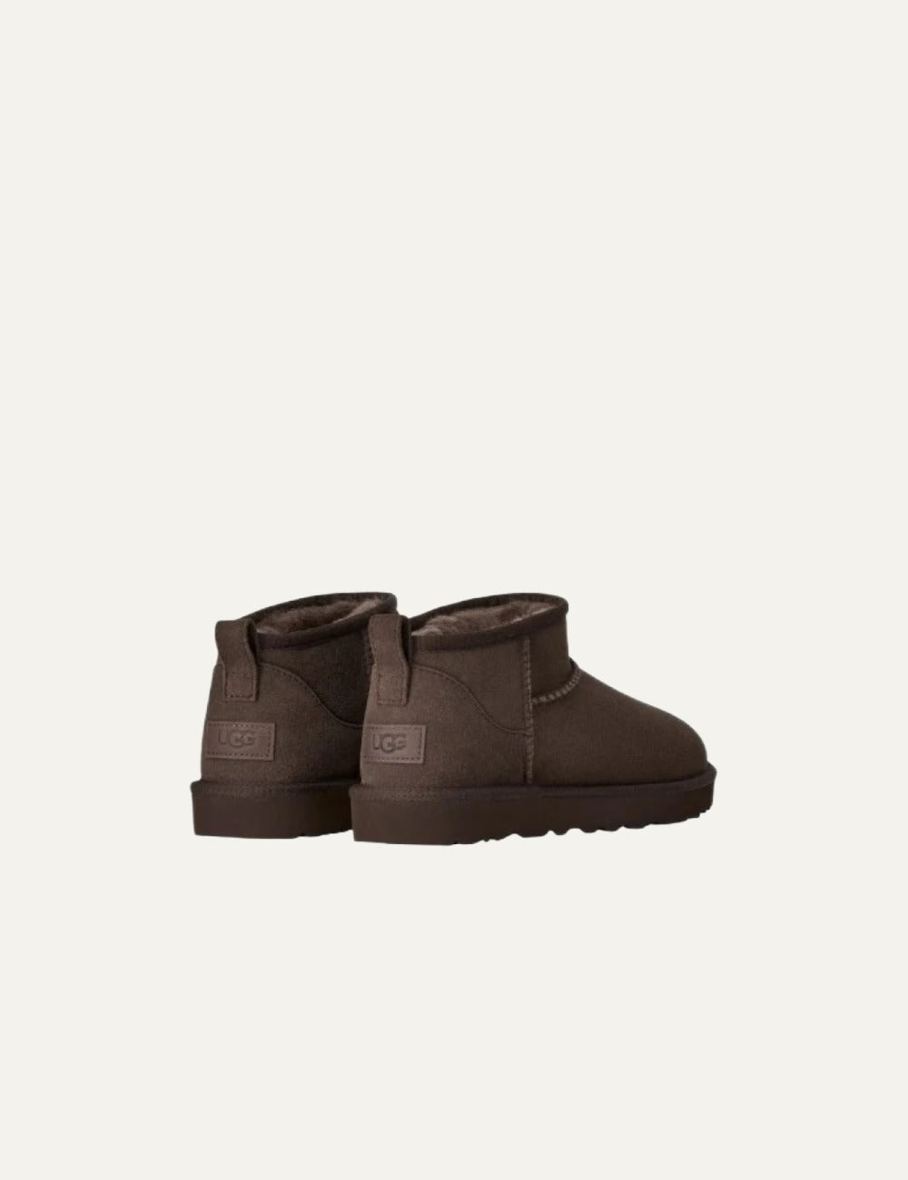 UGG Classic Ultra Mini women's boots in Dusted Cocoa dark brown suede with sheepskin lining, low ankle shaft, rear pull tab and lightweight EVA sole back view