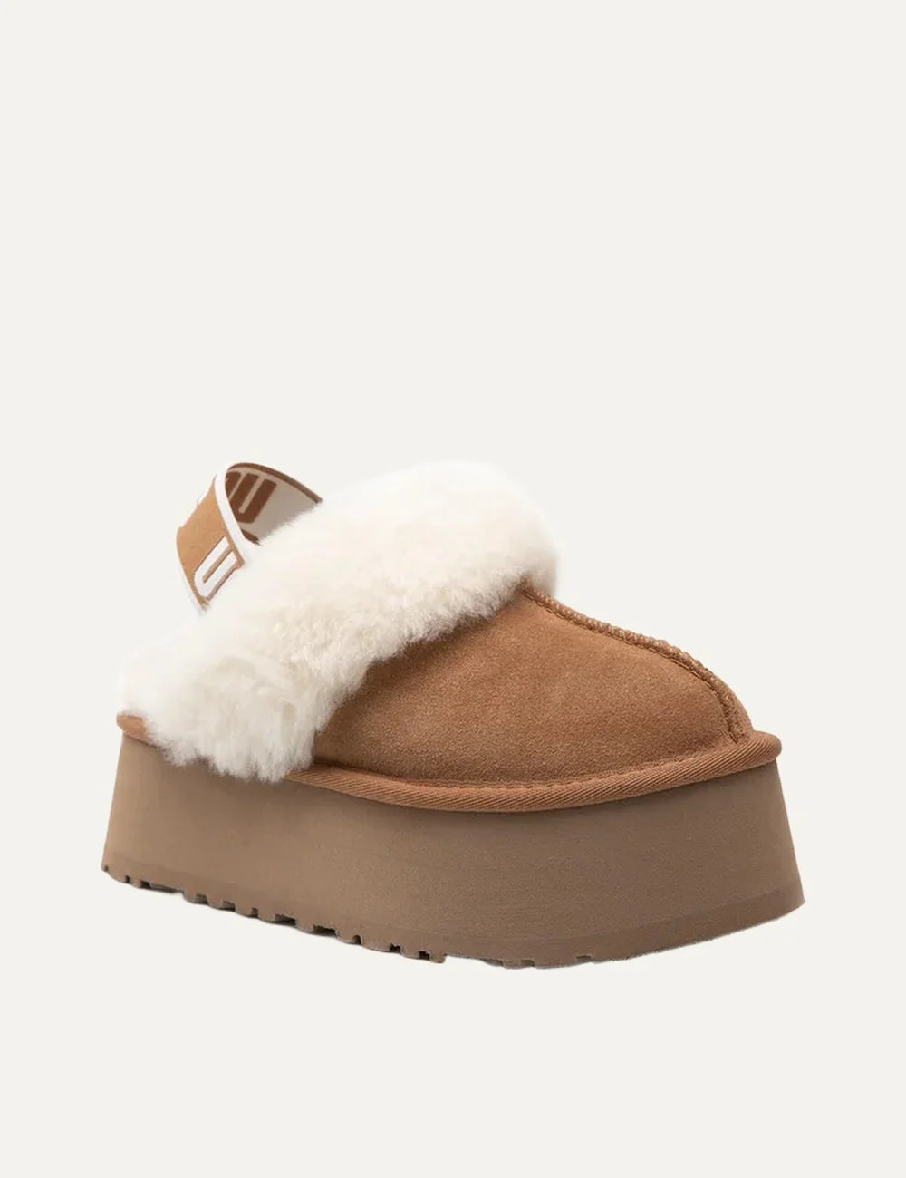 UGG Funkette chestnut suede platform slippers with fluffy cream sheepskin trim, logo heel strap and chunky tan sole angled