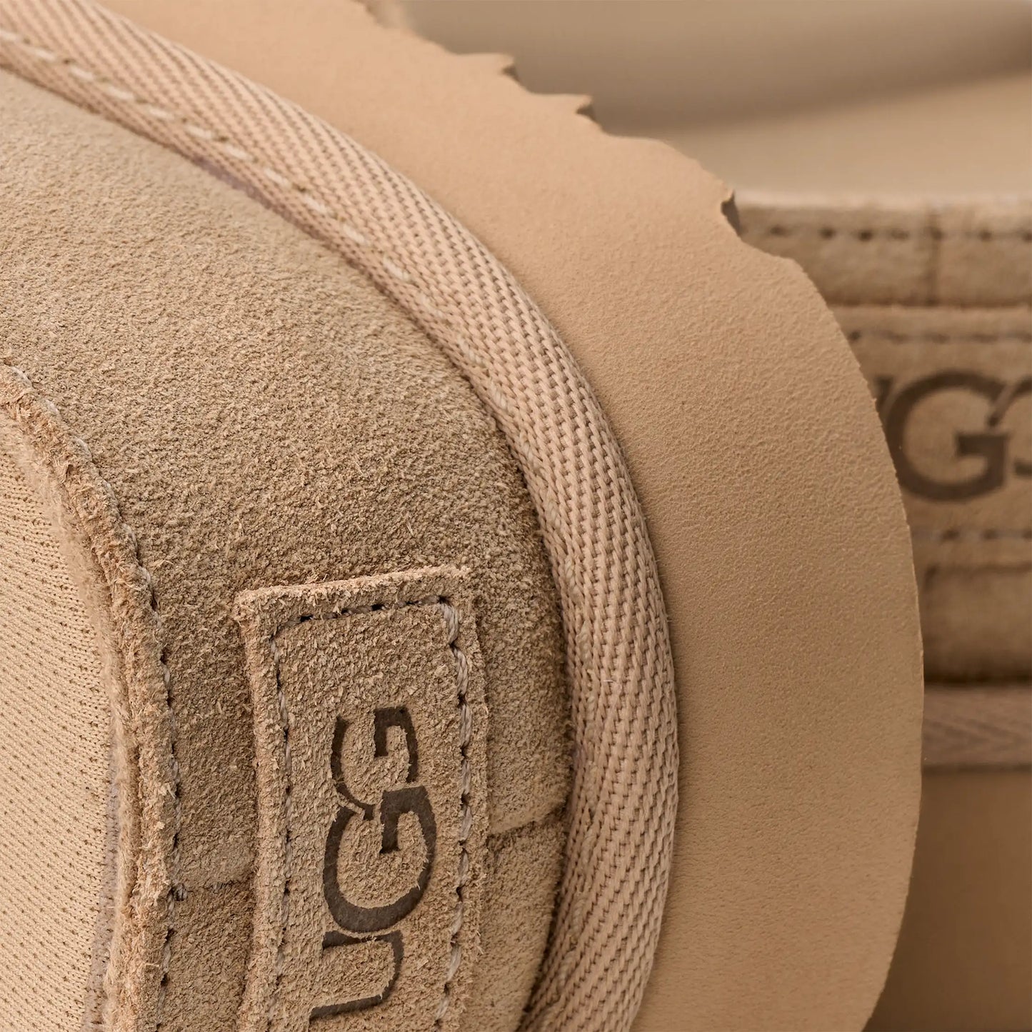 ugg suede slide sandal sand platform logo detail view