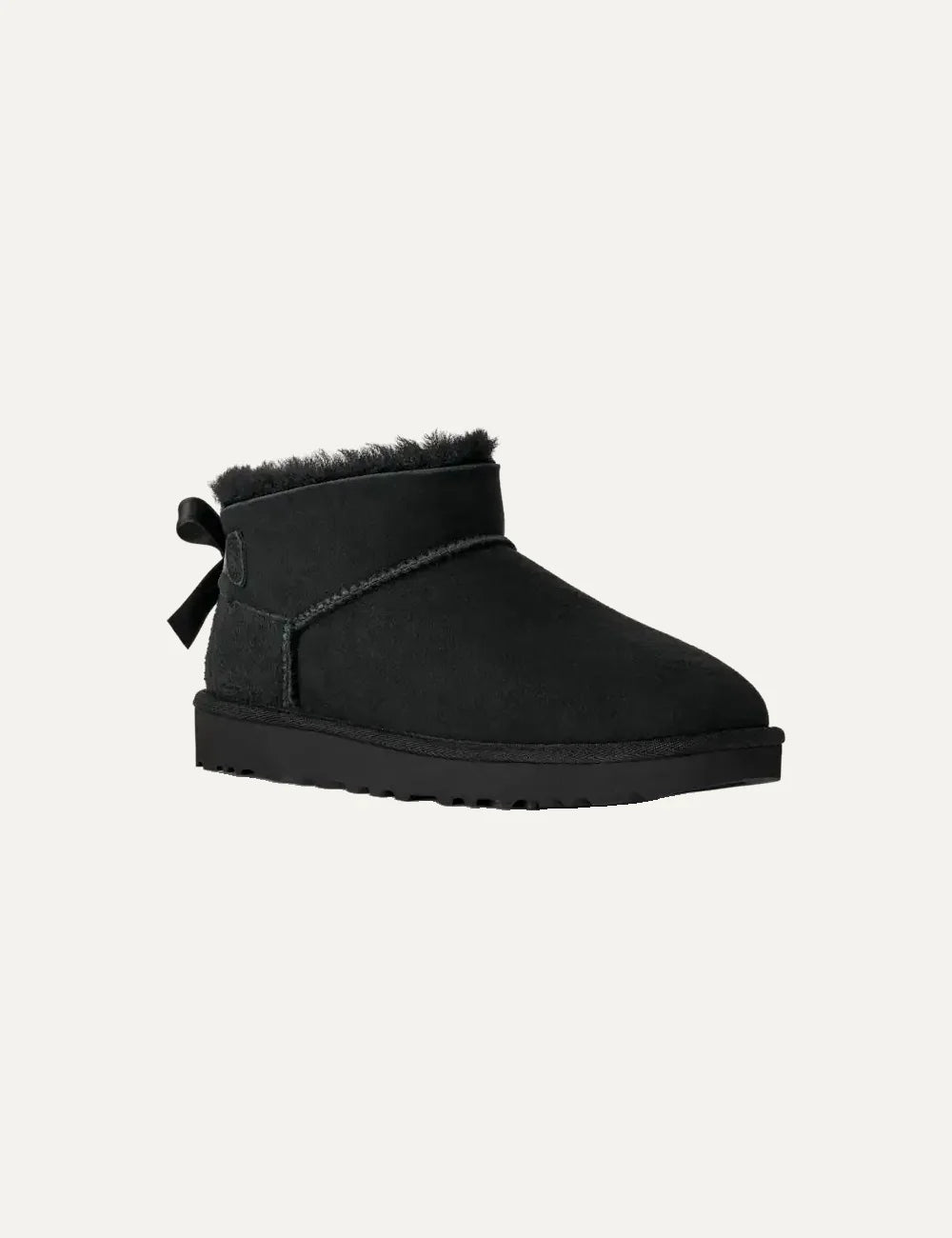 Women's UGG Bailey Bow Ultra Mini black boots with Twinface sheepskin, satin back bow and Sugarcane EVA sole angled