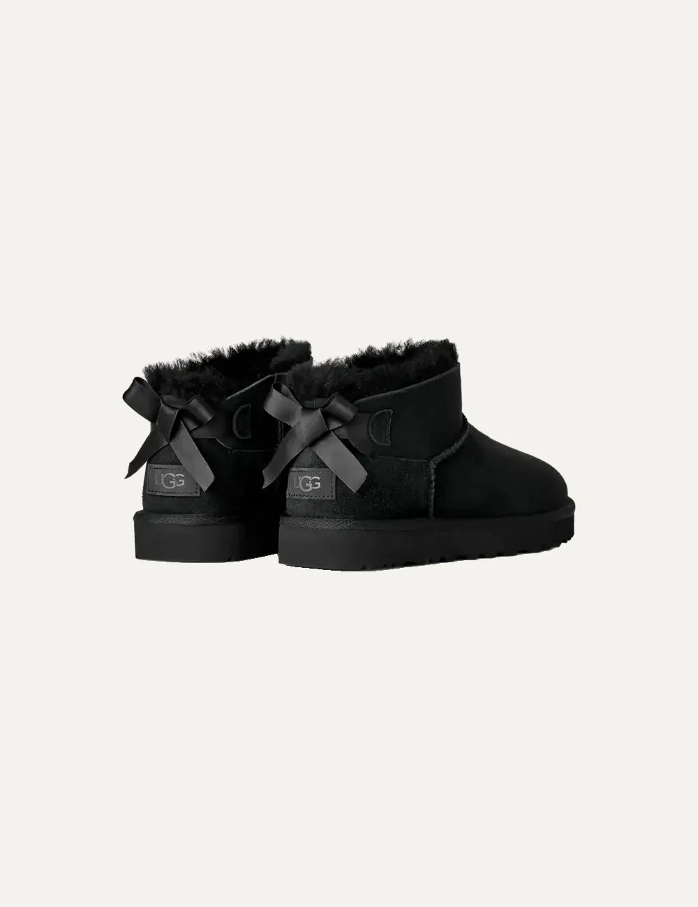 Women's UGG Bailey Bow Ultra Mini black boots with Twinface sheepskin, satin back bow and Sugarcane EVA sole back
