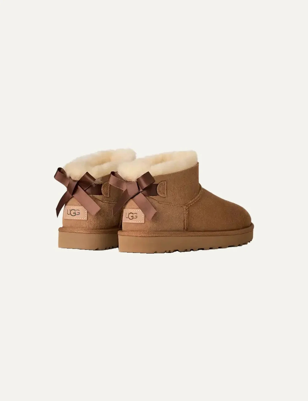 Women's UGG Bailey Bow Ultra Mini Chestnut boots with Twinface sheepskin, satin back bow and Sugarcane EVA sole back