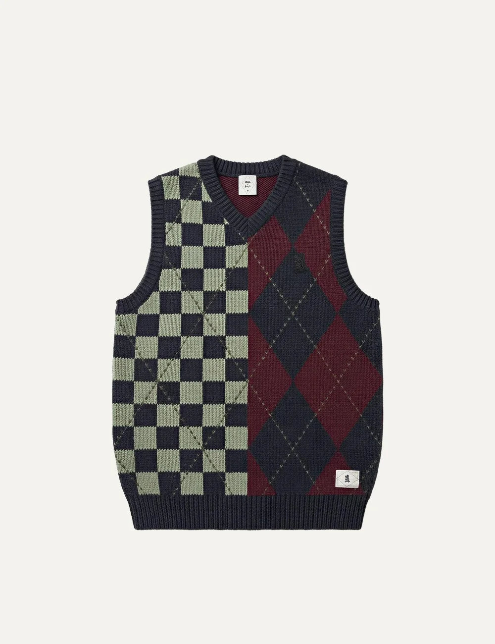 Vans men's knitted sweater vest in navy blue, burgundy and light green, featuring asymmetric checkerboard and argyle patterns, V-neck, embroidered chest logo and ribbed trims.