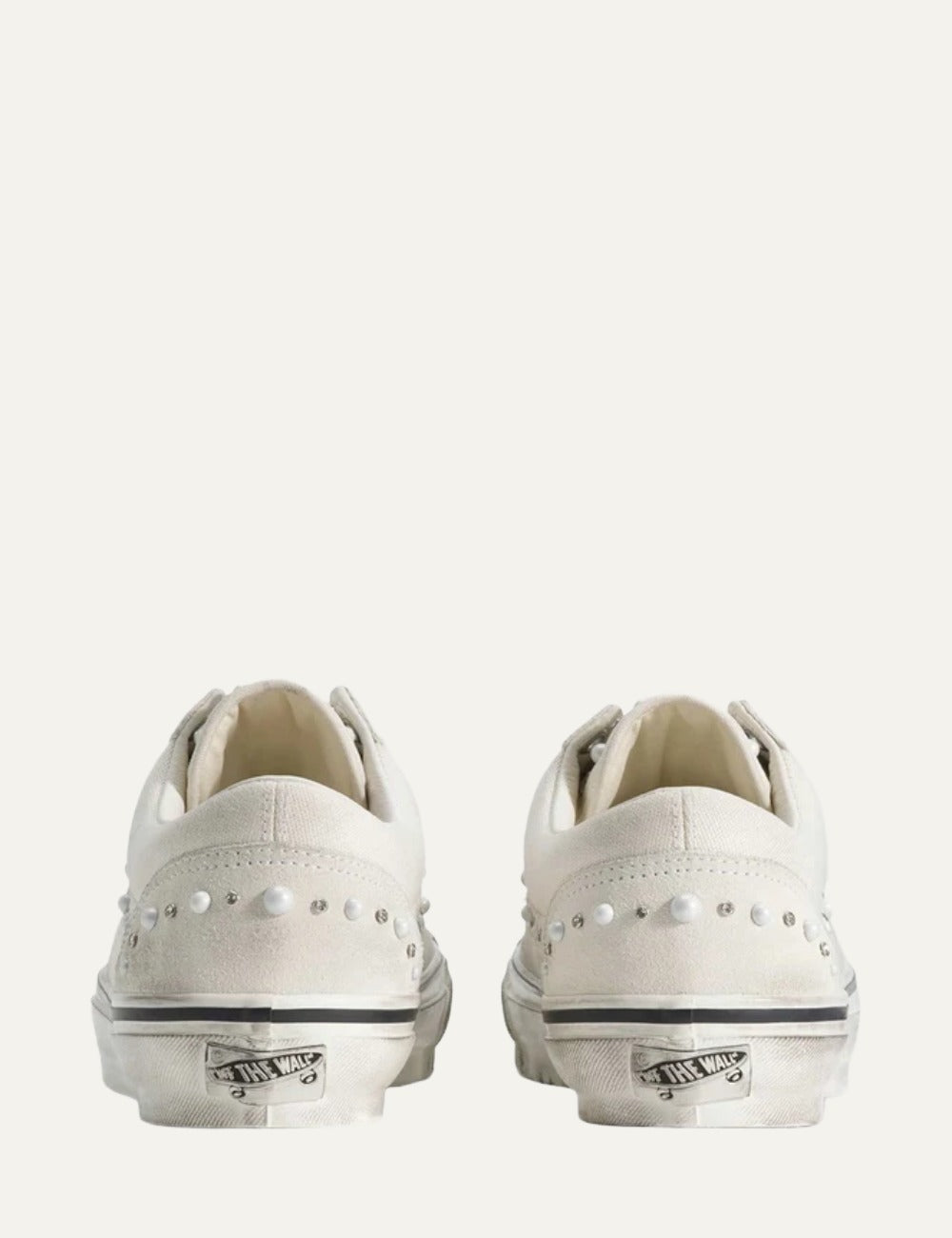 White Vans low-top sneakers with suede and leather panels, pearl and silver stud embellishments, lace-up fastening and white rubber sole back