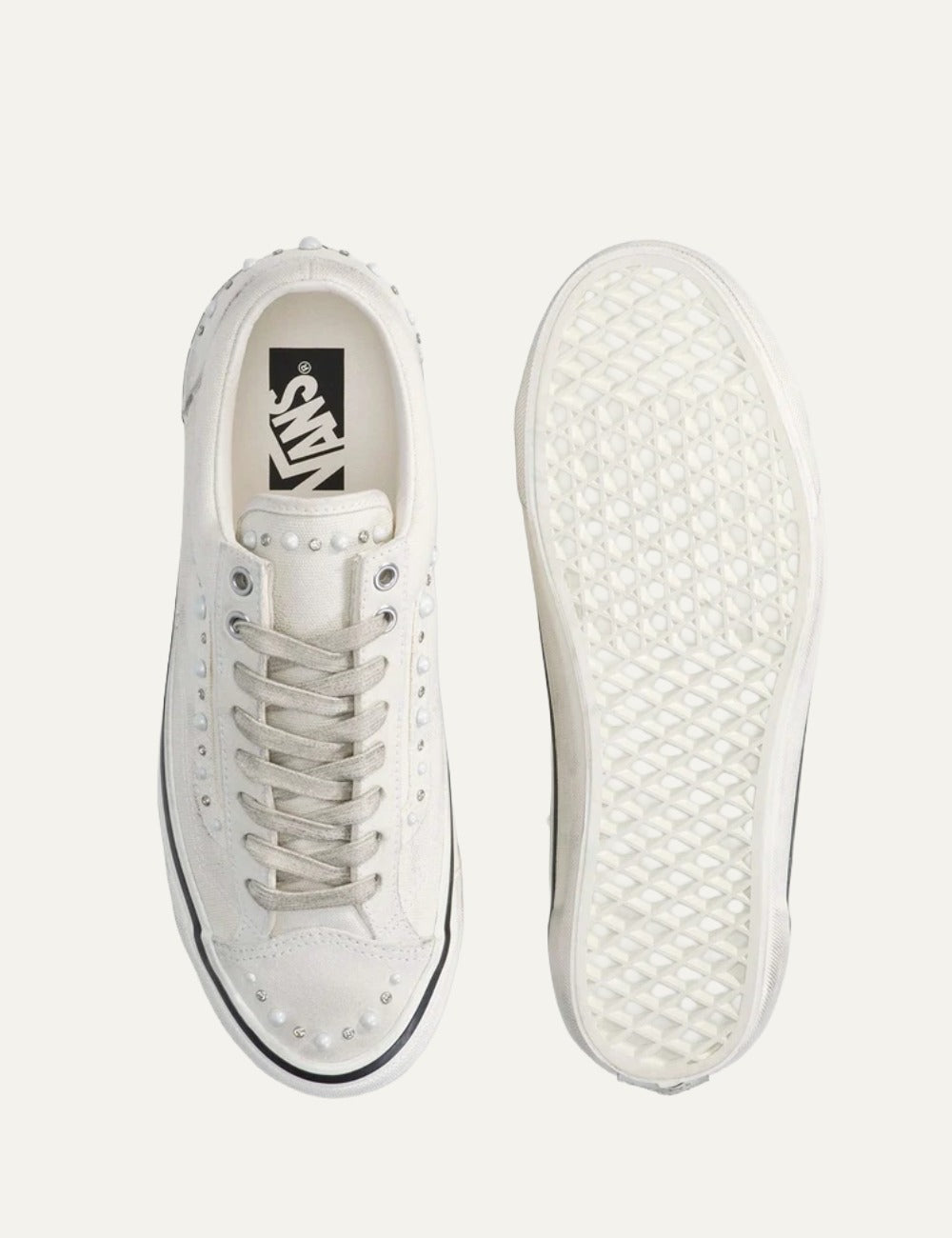 White Vans low-top sneakers with suede and leather panels, pearl and silver stud embellishments, lace-up fastening and white rubber sole top
