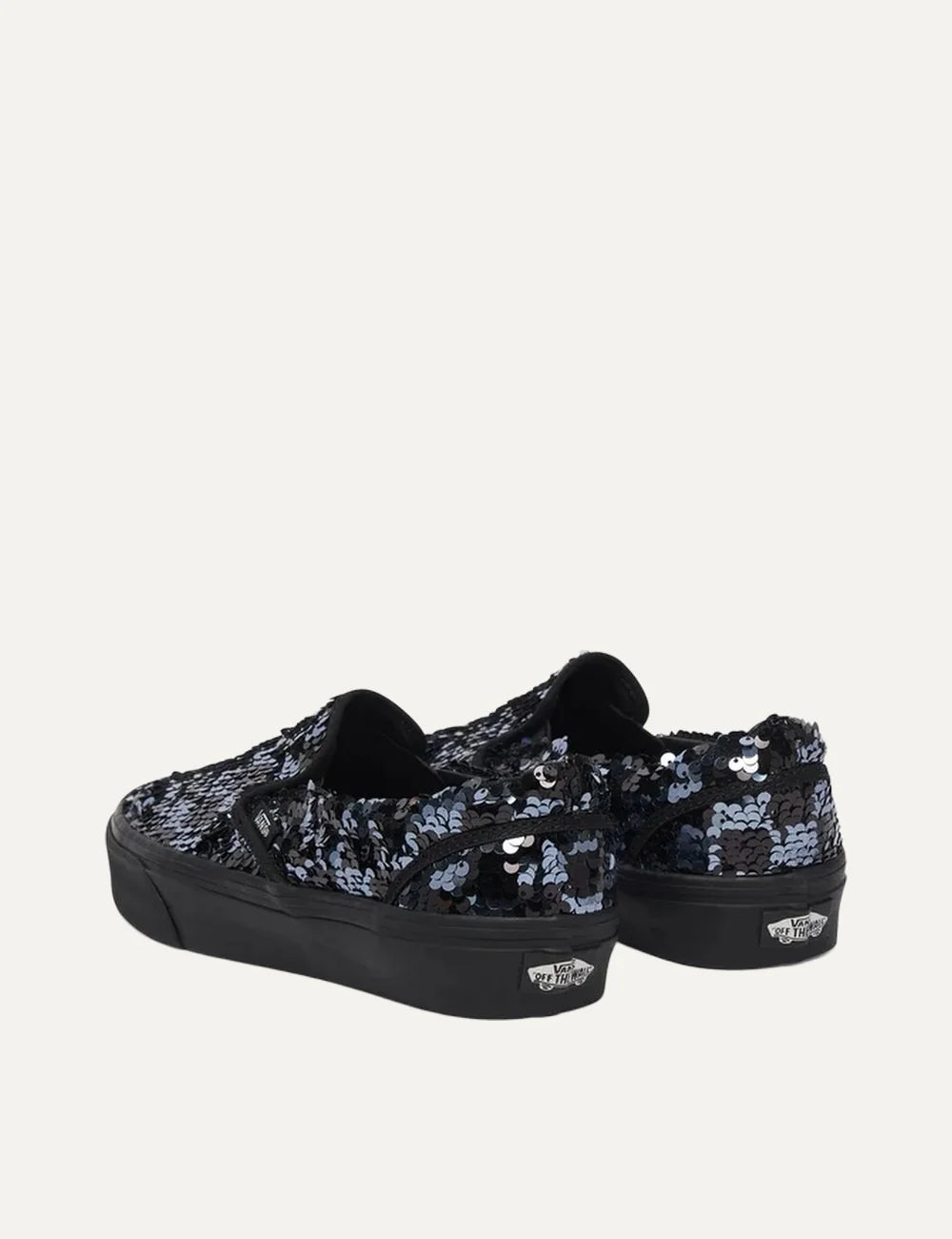 Vans Classic Slip-On women's black sneakers with black and silver sequins, elastic side panels and black rubber sole pair back view