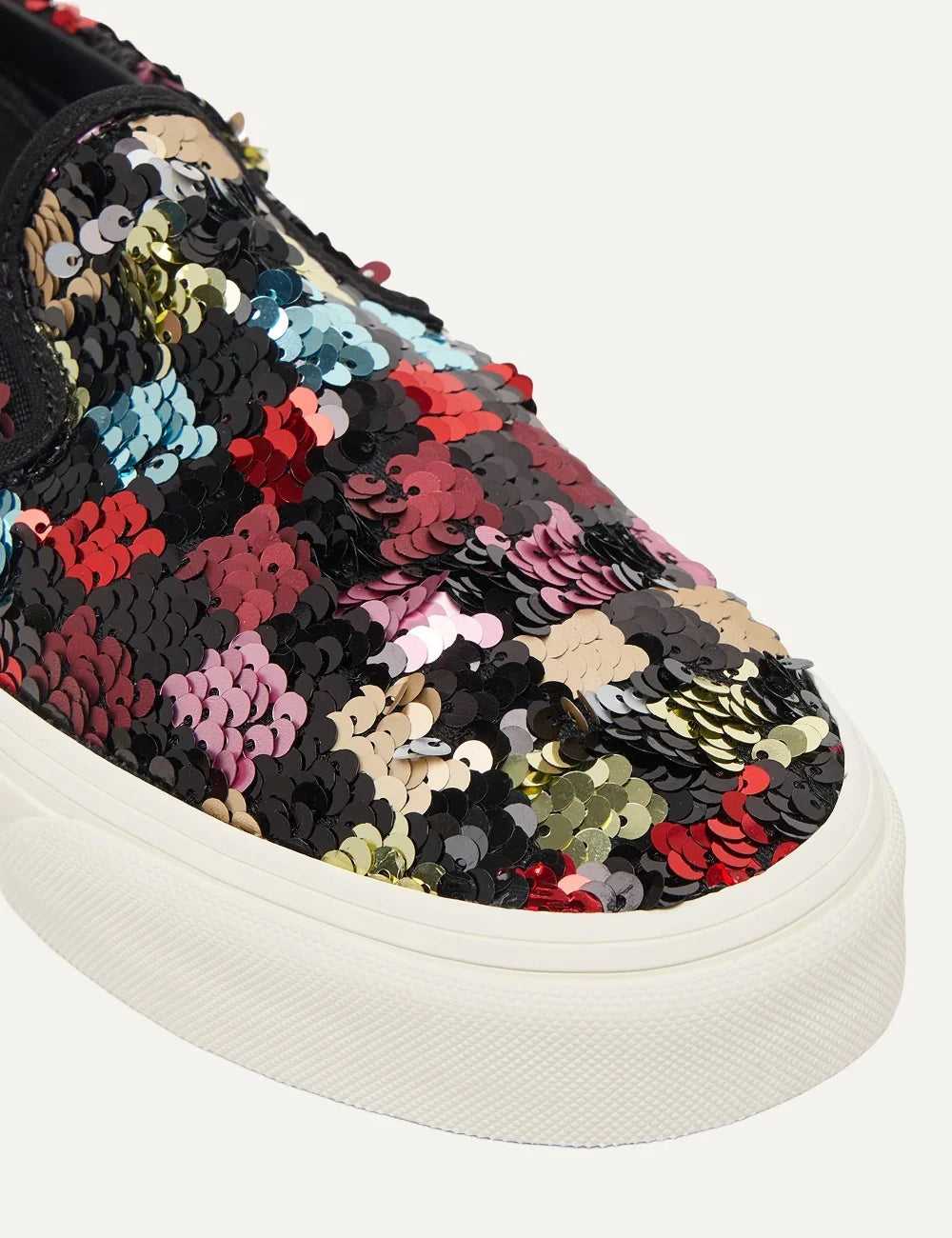 Vans Classic Slip-On women's sneakers in black with multicolored sequins, elastic side panels and white rubber sole toe view