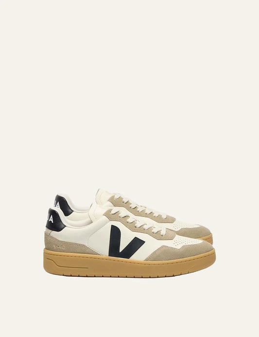 VEJA women's V-90 ecru leather sneakers with beige suede panels, black V logo and caramel rubber sole.