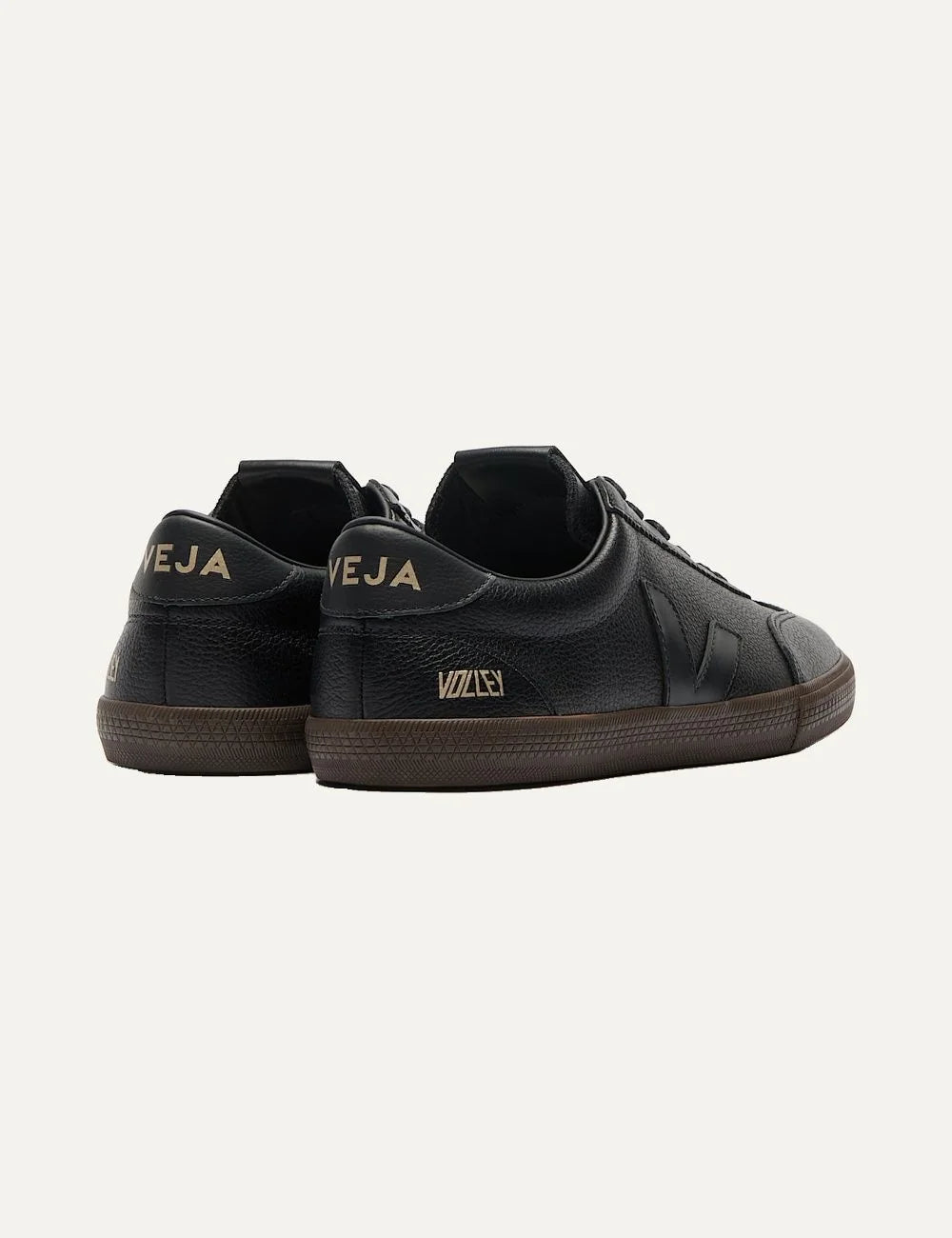 VEJA women's Volley Signature black leather sneakers with tonal V logo, gold branding, black laces and dark brown rubber sole back