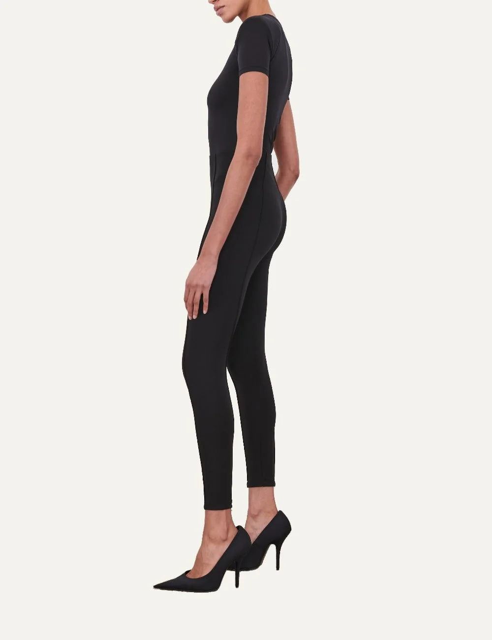 Wardrobe NYC women's black Bonded Legging in Italian technical stretch jersey featuring a high-rise bonded waistband, matte finish, slim fit and front and back pintuck seams side