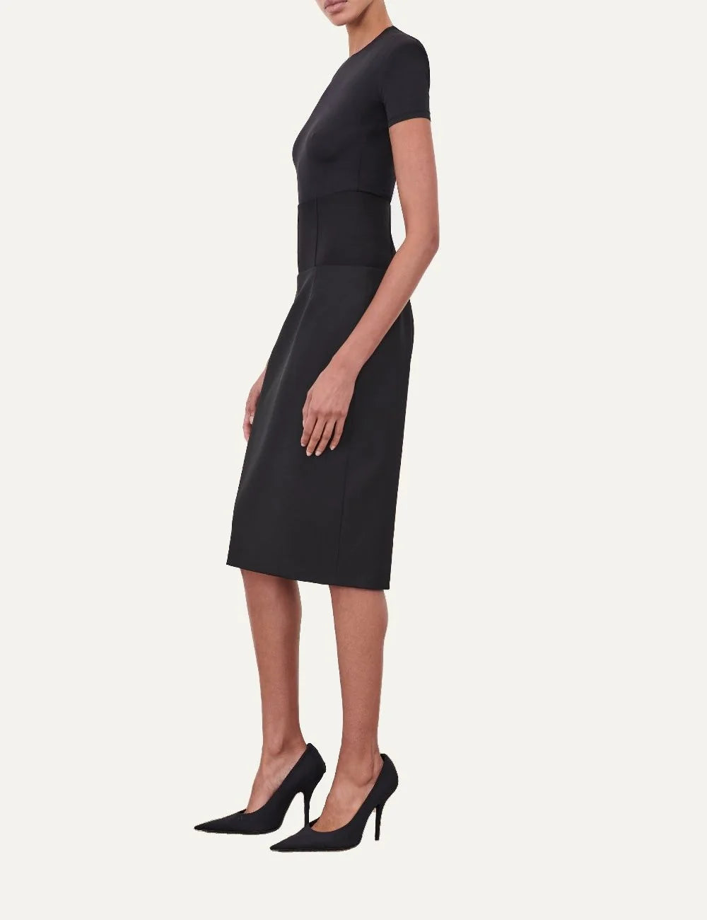 Wardrobe NYC women's Blade Cap Sleeve Bodysuit in black Italian stretch jersey with short sleeves, padded shoulders, round neckline and fitted silhouette side