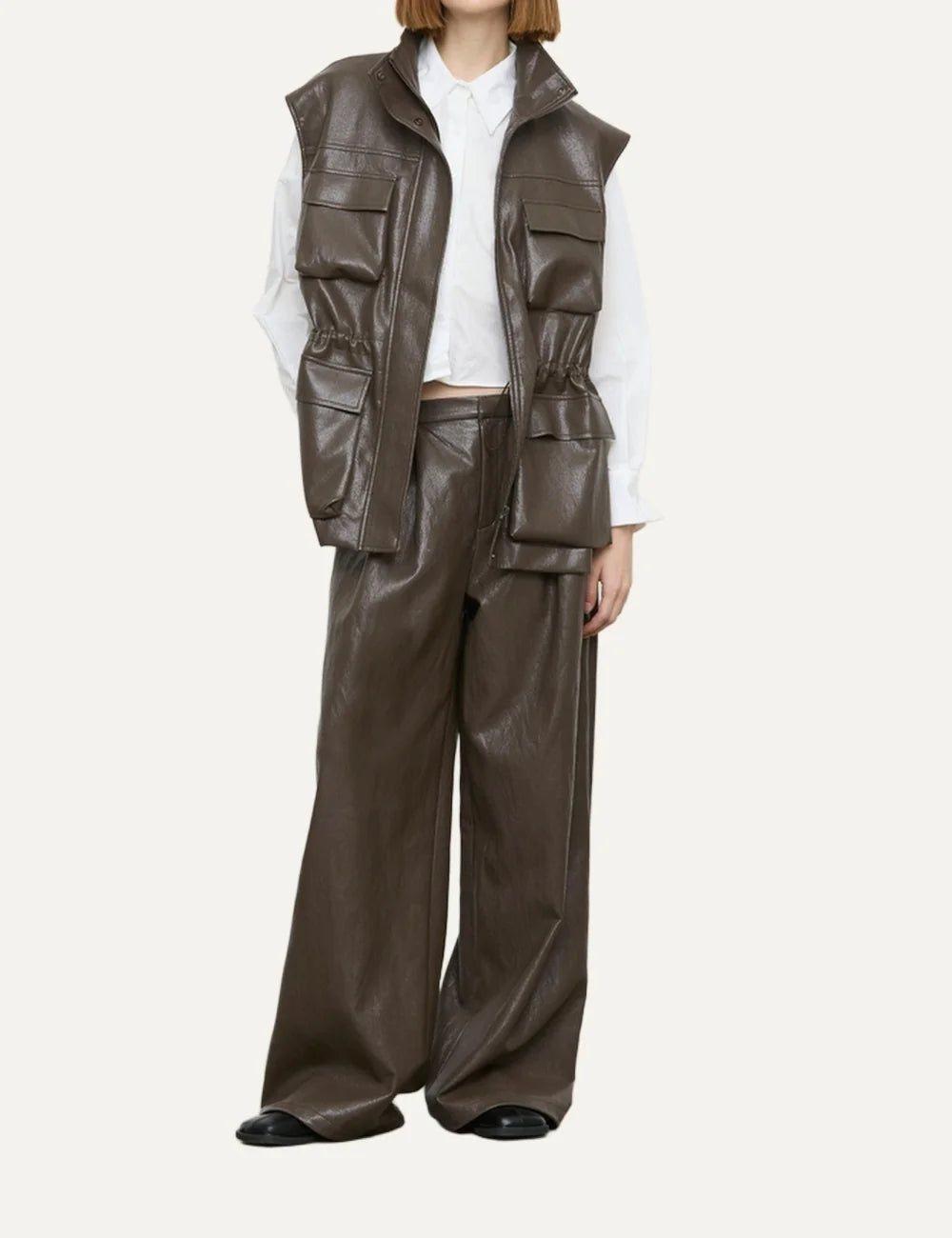 Women's brown faux leather wide-leg trousers with front pleats, belt loops and side pockets full body