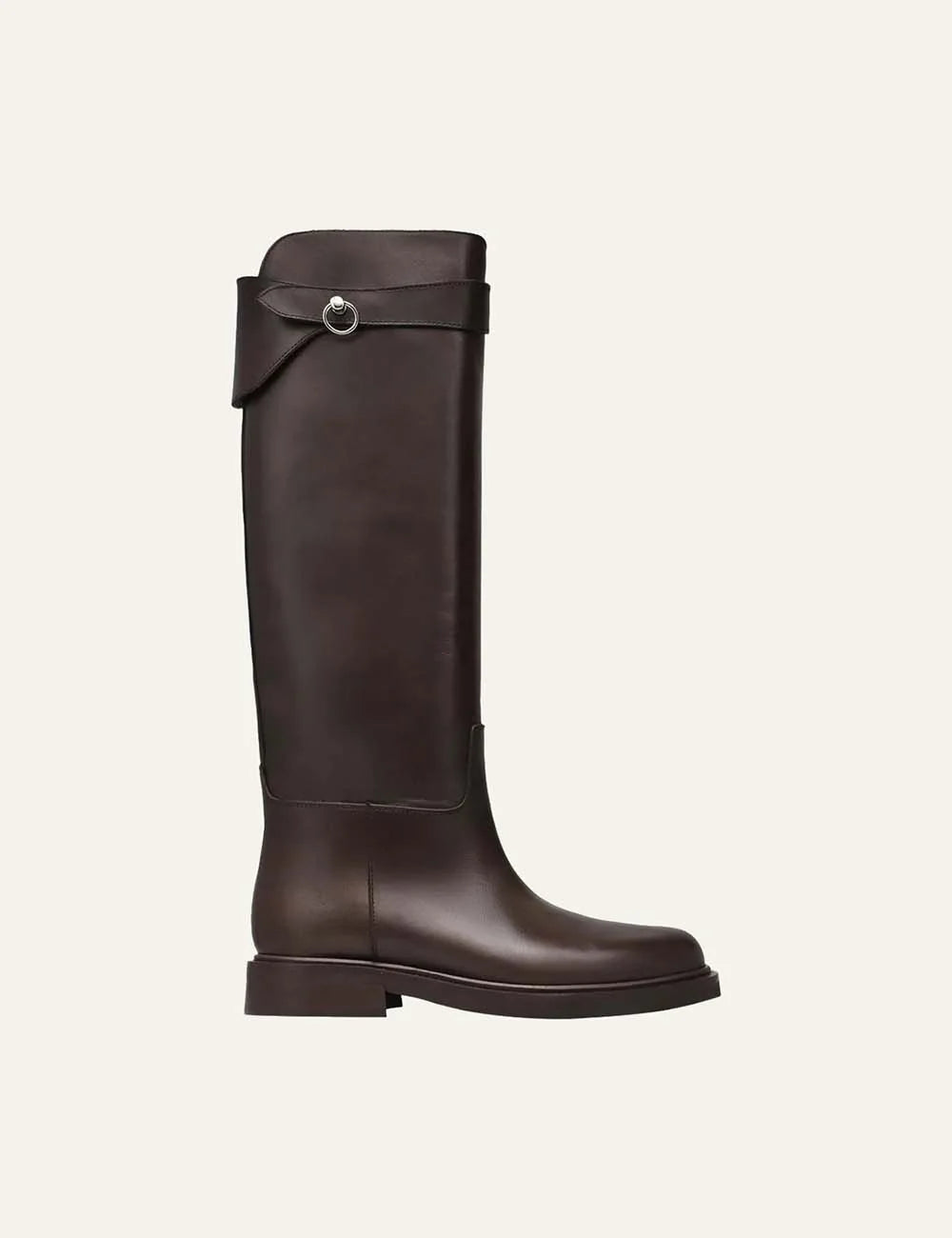 Women's dark brown smooth leather knee-high boots with round toe, low flat heel, asymmetric shaft and silver-tone ring strap detail.