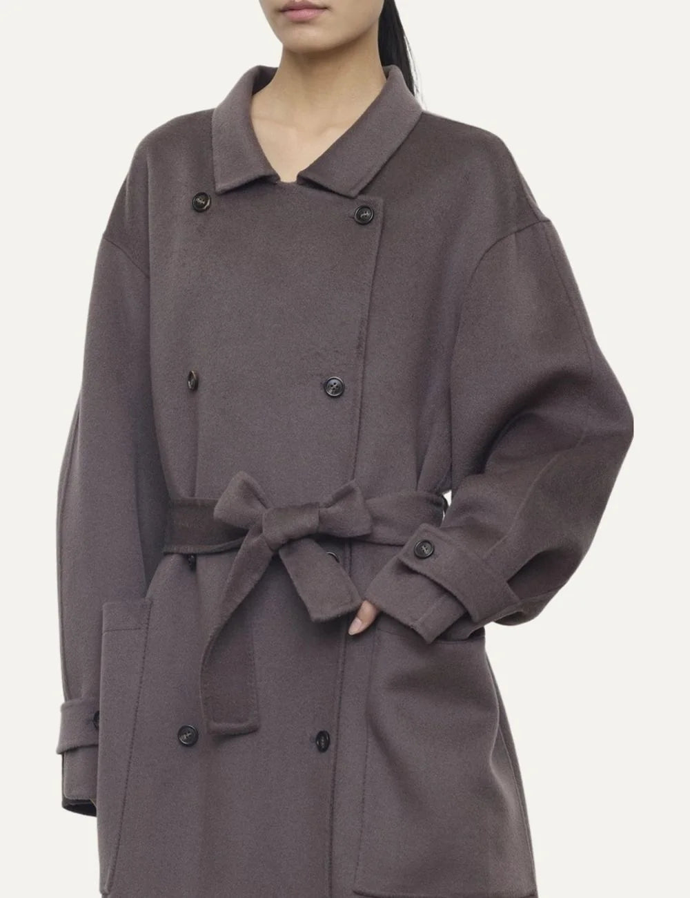 Women's grey brown oversized long double-breasted coat with shirt collar, matching waist belt and large patch pockets detail