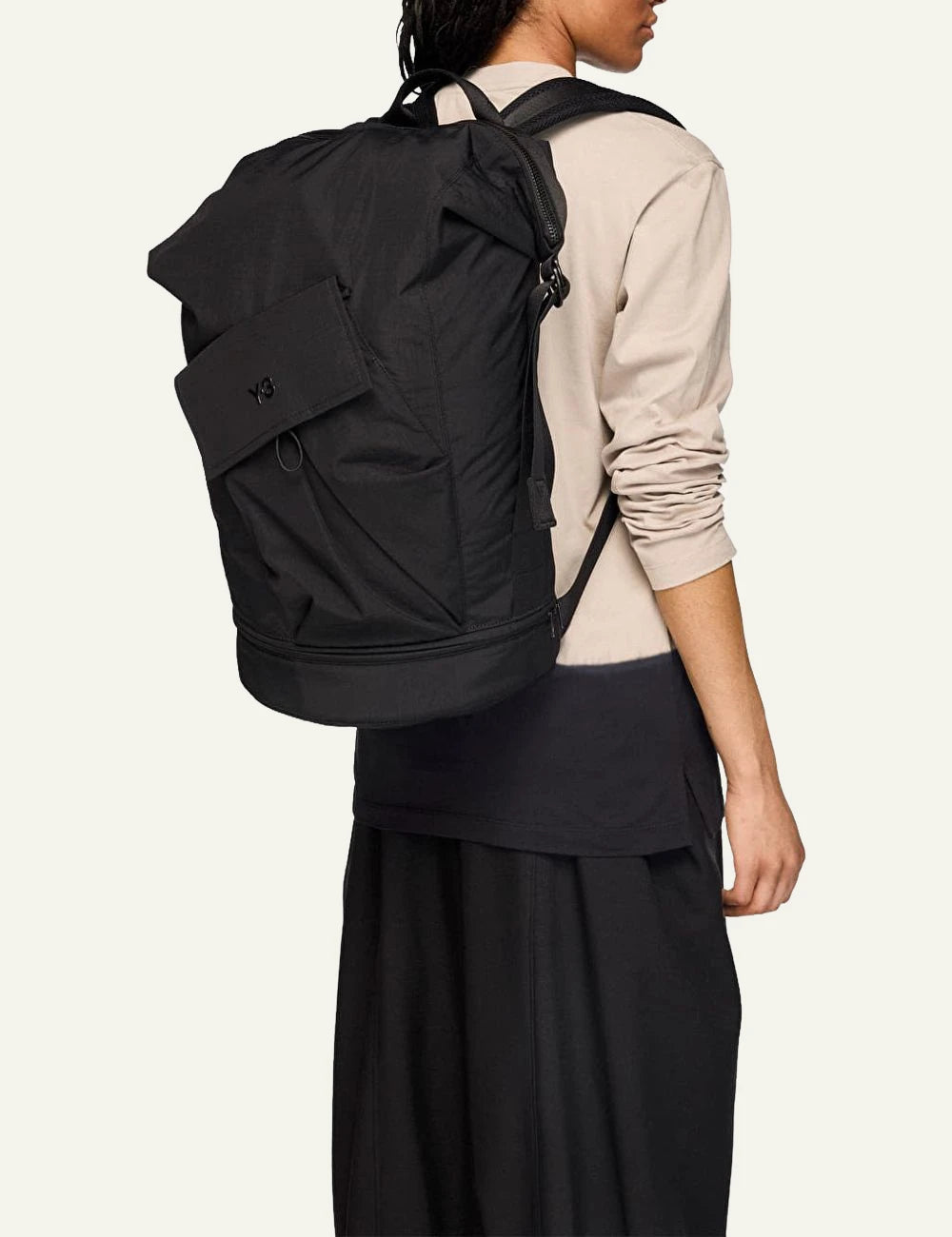 Y-3 black bucket backpack with flap pocket side model view