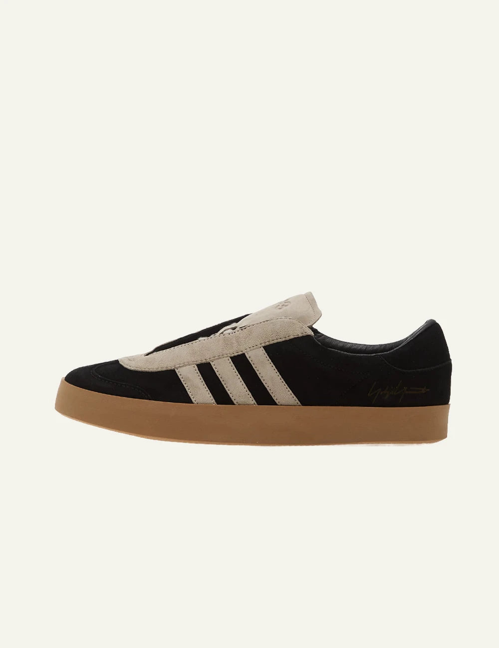 Y-3 black suede sneakers with beige stripes gum sole profile view
