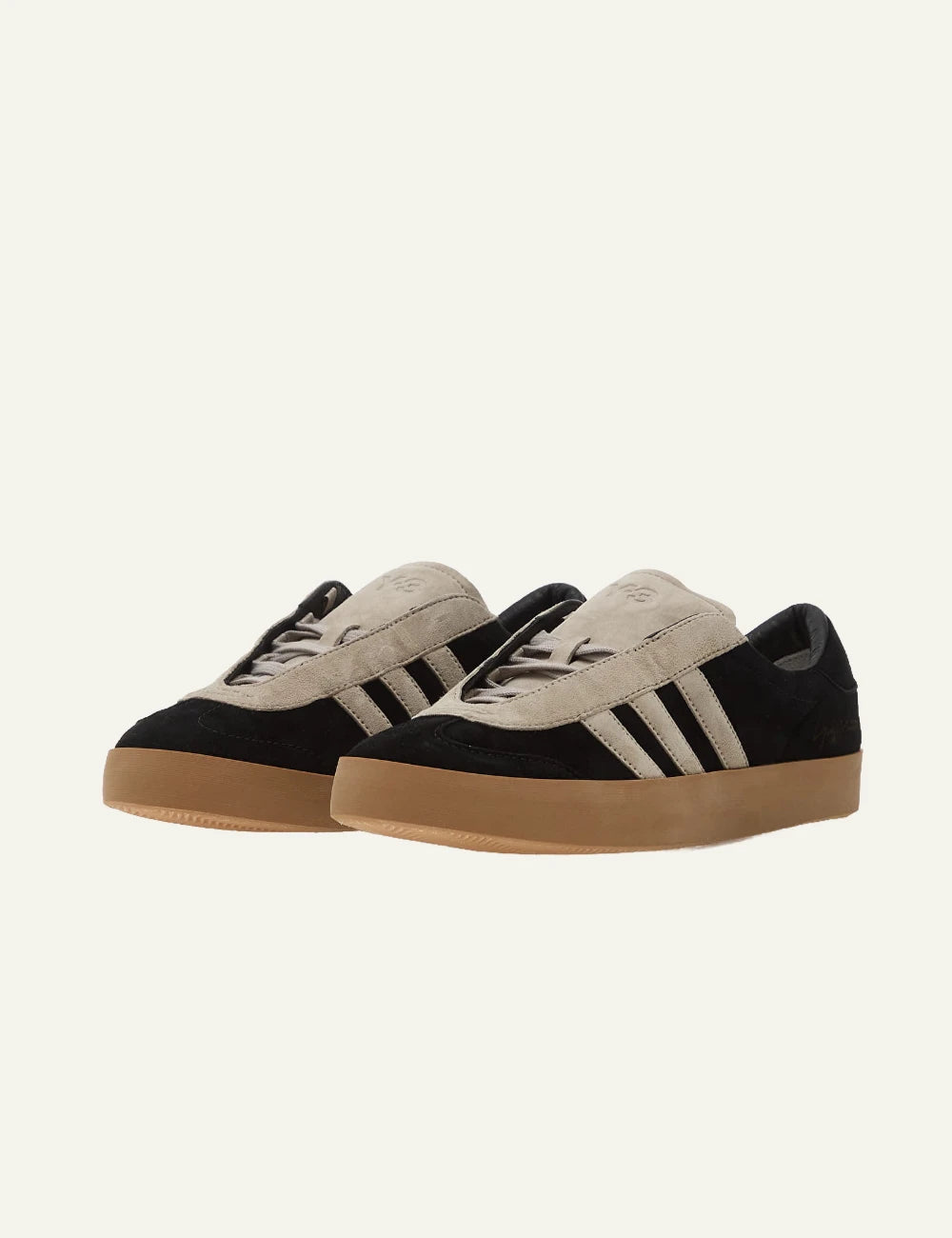 Y-3 black suede sneakers with beige stripes gum sole angled view