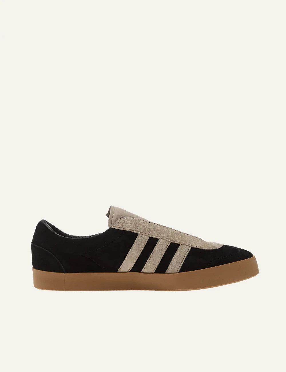 Y-3 black suede sneakers with beige stripes gum sole side view