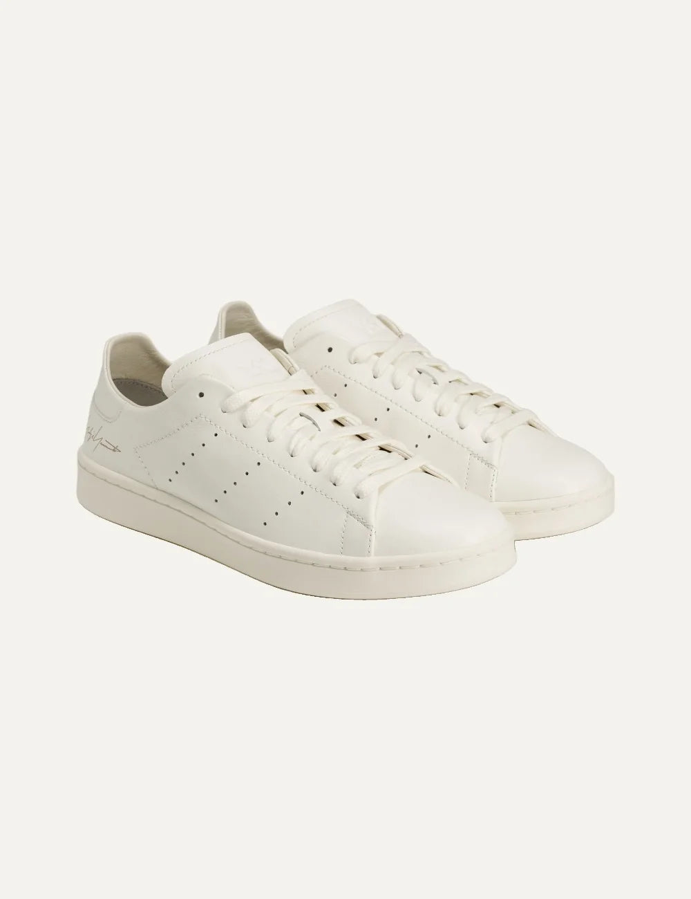 Y-3 men's off-white leather sneakers with Yohji Yamamoto signature angled