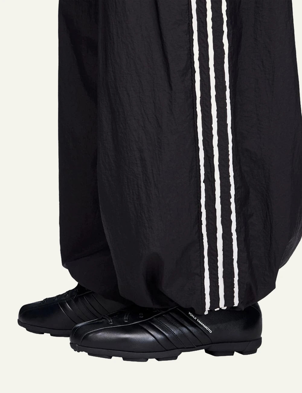 Y-3 wide leg track pants black three stripes side detail view