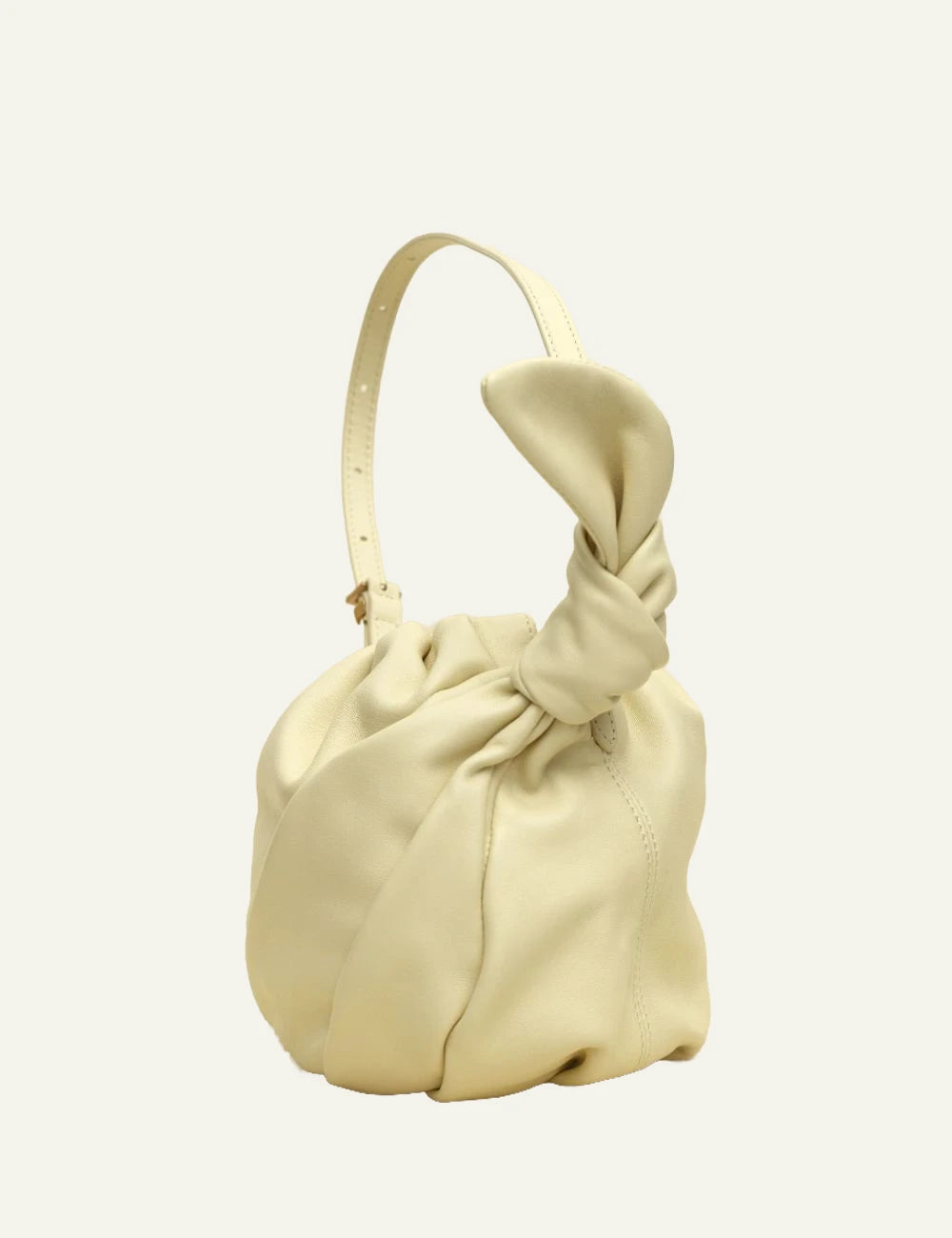 Yellow leather drawstring bucket bag with shoulder strap full angle view