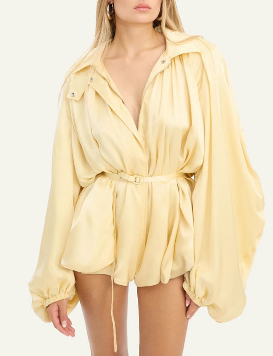 Yellow satin mini dress with voluminous sleeves and belt worn by model front model view